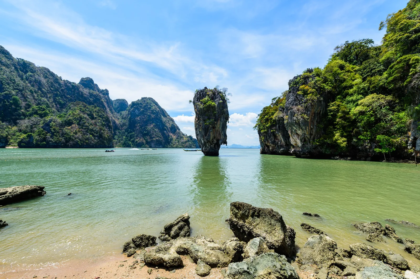 A shallow beach facing the limestone cliffs