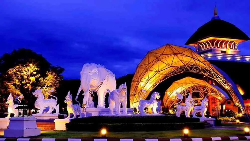 The park lit in the evening