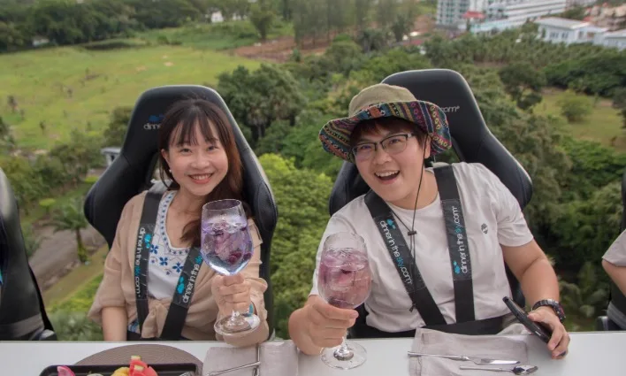 Diners raise a glass at a height of fifty meters