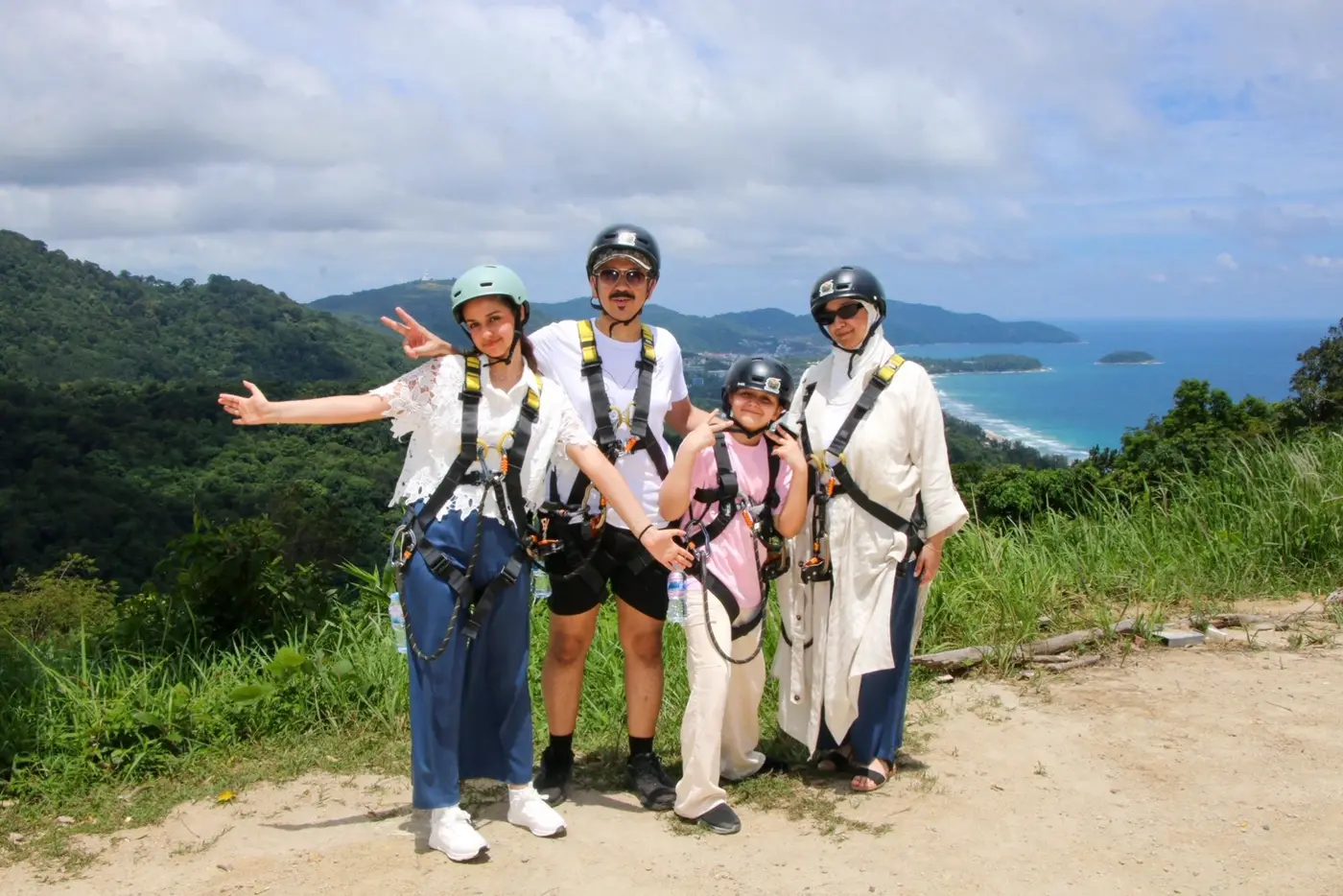 A group at a viewpoint above Phuket's coastline