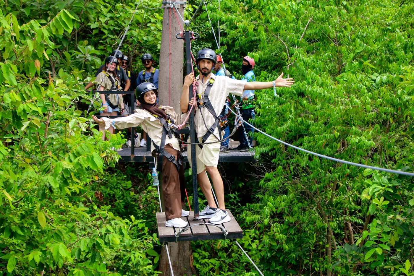A traveler on a wooden platform among the trees