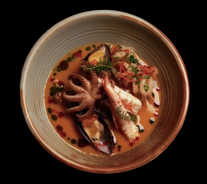 A seafood soup with octopus and mussels
